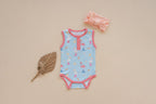 a baby clothes and headband