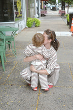 a woman kissing a child